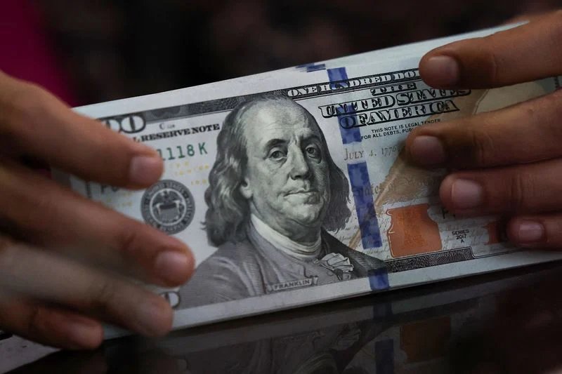 Dollar hits 3-month low vs euro, pares losses after Treasury move By Reuters